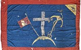 Επαναστατική σημαία της Ύδρας. Απεικονίζονται τα σύμβολα της Φιλικής Εταιρείας και η επιγραφή: Η ΤΑΝ Η ΕΠΙ ΤΑΣ 1821. Ζωγραφισμένη στο χέρι σε λινό ύφασμα. Διαστ. 320 × 236 εκ. 19ος αιώνας